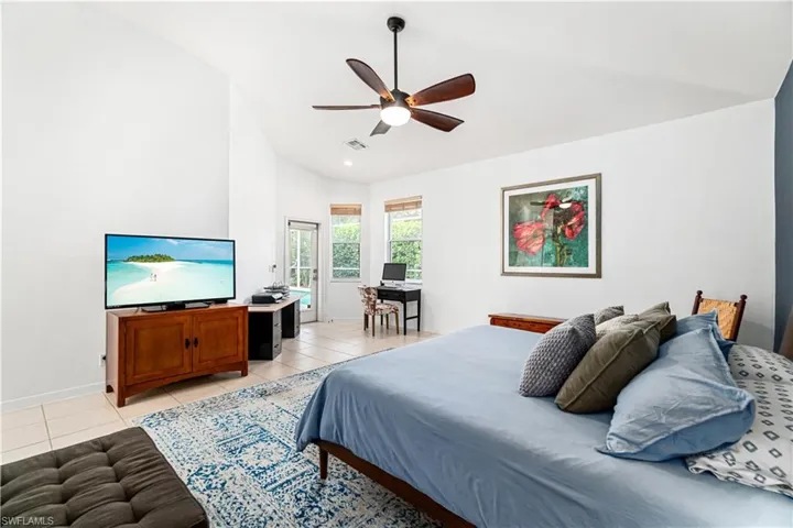 Oversized primary suite with office area/sitting nook & huge walk-in closet with custom shelving.