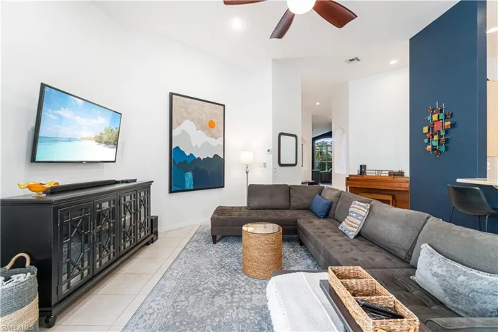 Living room with soaring ceilings and access to the pool deck