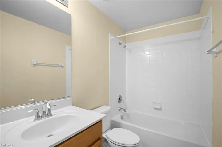 Full bath featuring shower / tub combination and vanity