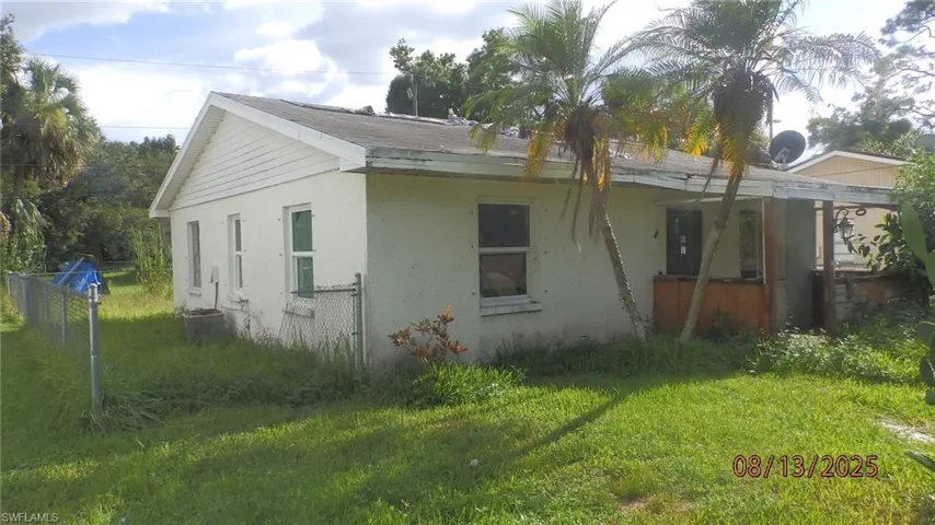 Back of property with stucco siding