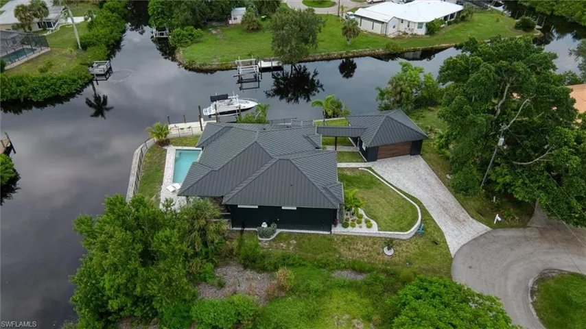 Waterfront residence featuring a private pool and direct canal access