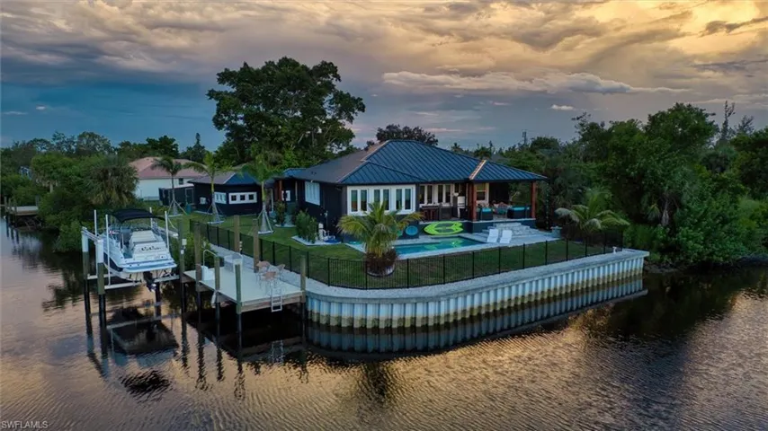 Waterfront property featuring a private boat lift and dock