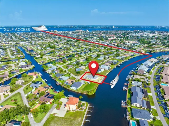 Aerial perspective of suburban area with a large body of water
