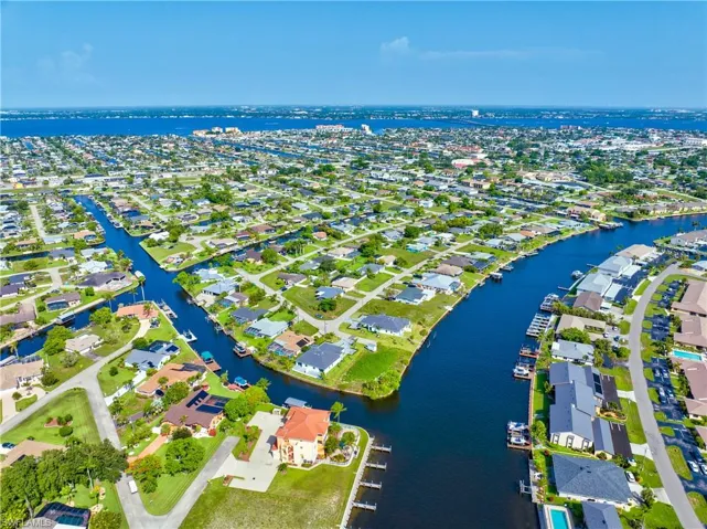 Aerial perspective of suburban area with a large body of water