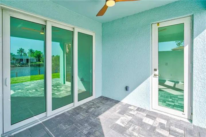 Unfurnished sunroom with a water view