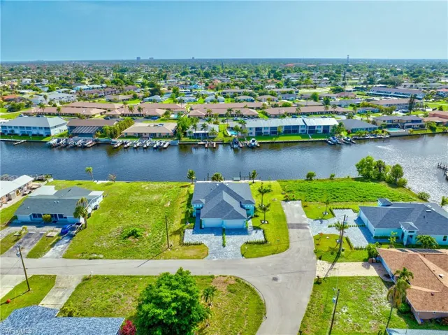 Aerial perspective of suburban area with a large body of water