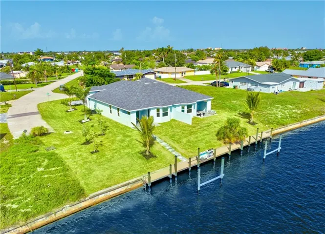 Aerial view of residential area with a nearby body of water