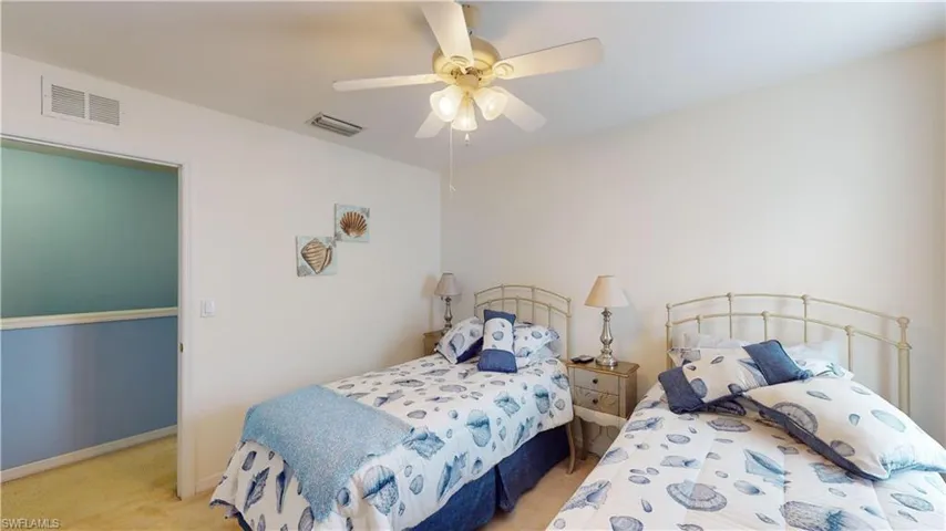 Bedroom with carpet and ceiling fan