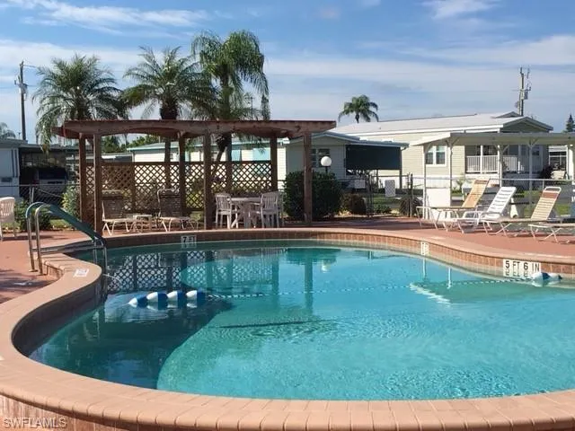 View of swimming pool with a patio area