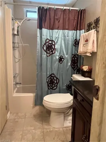 Bathroom featuring tile walls