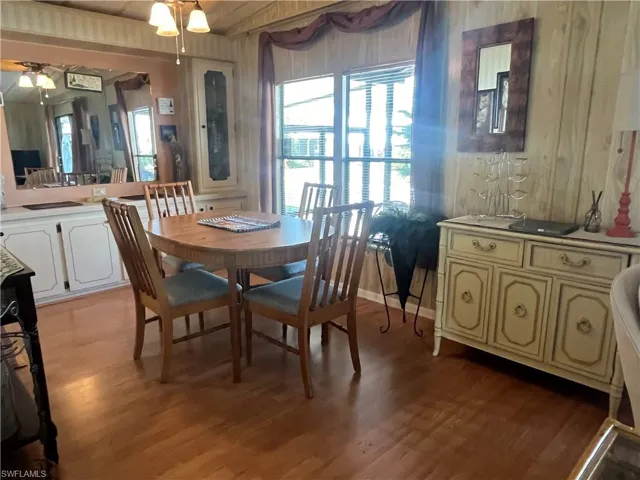 Dining room featuring light wood-type flooring and ceiling fan