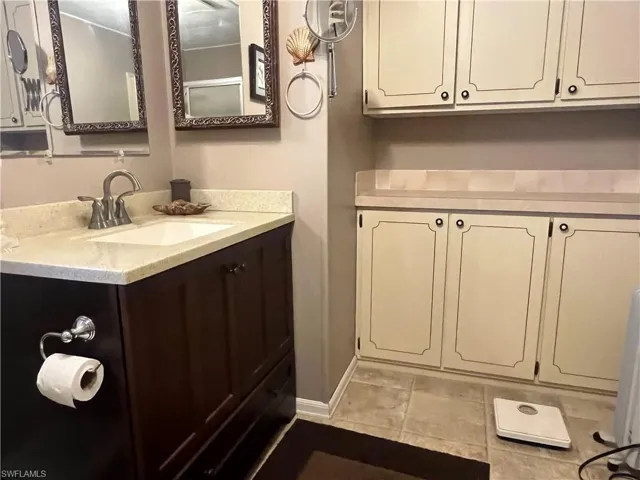 Bathroom featuring vanity and tile patterned floors