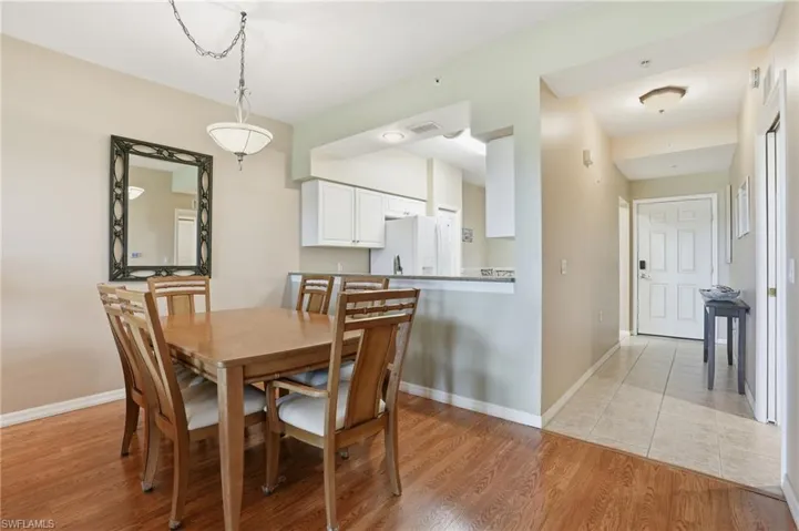Dining area with light wood finished floors and baseboards