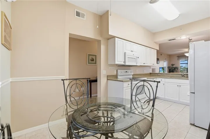 Dining room with light tile patterned floors
