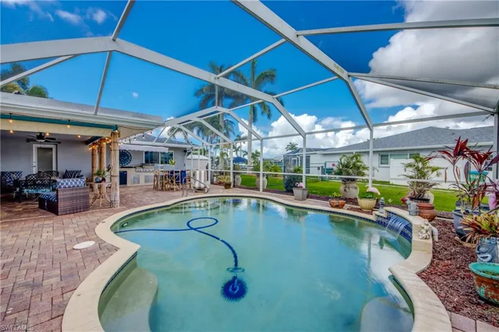 View of swimming pool with water feature