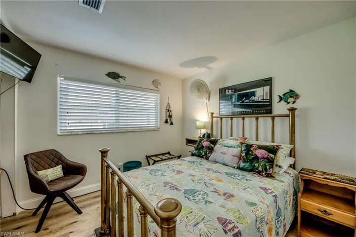 Bedroom with light hardwood / wood-style floors