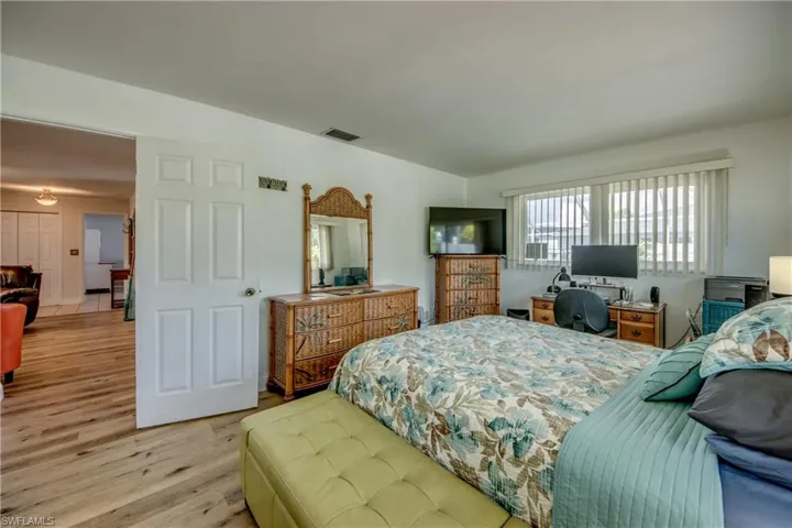 Bedroom featuring wood-type flooring