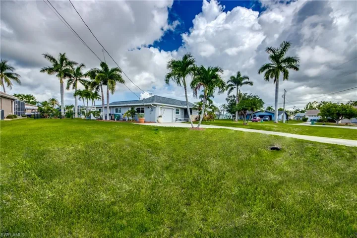 View of yard with a garage
