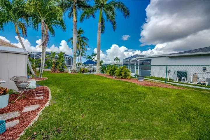 View of yard featuring a lanai