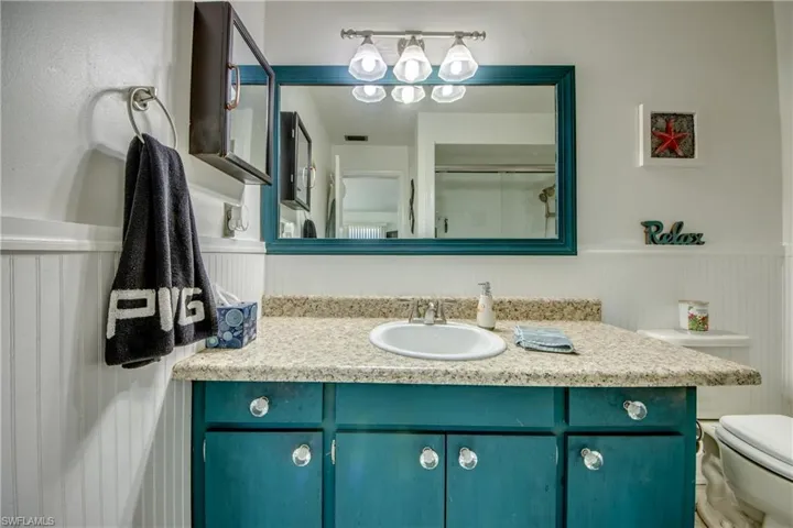 Bathroom featuring vanity and toilet