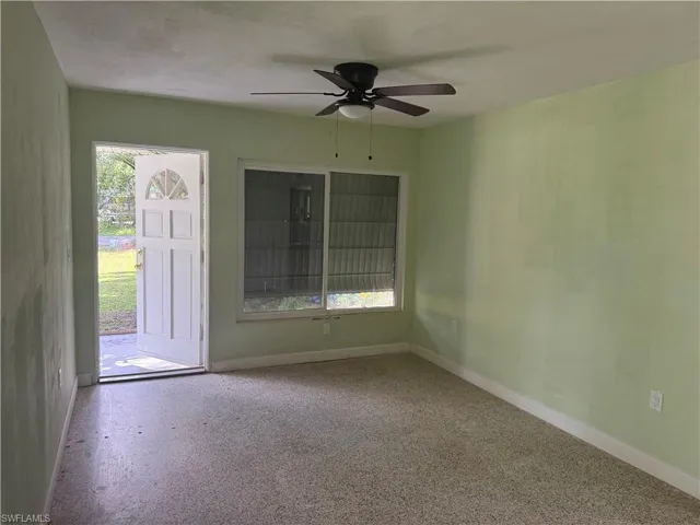 Front entrance room with ceiling fan
