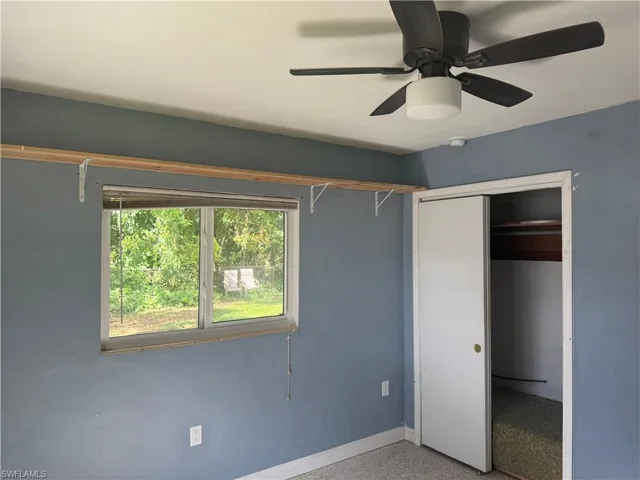 Bedroom featuring a closet and ceiling fan