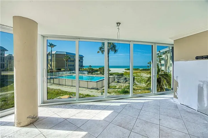 Great room view overlooking pool and Gulf of Mexico