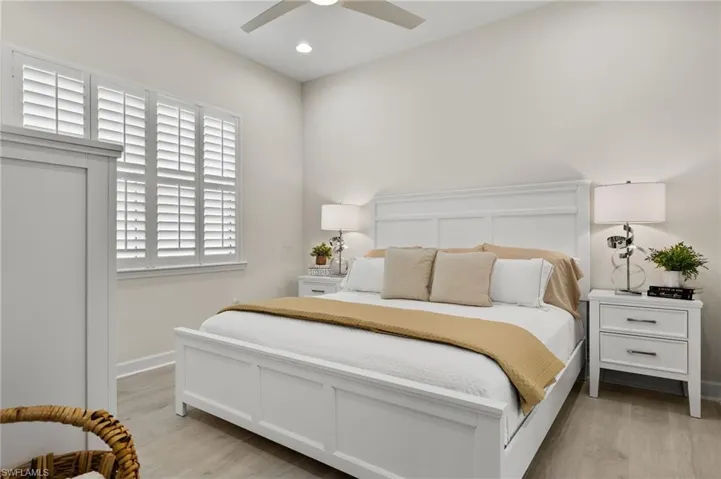 Bedroom with light wood-type flooring and ceiling fan