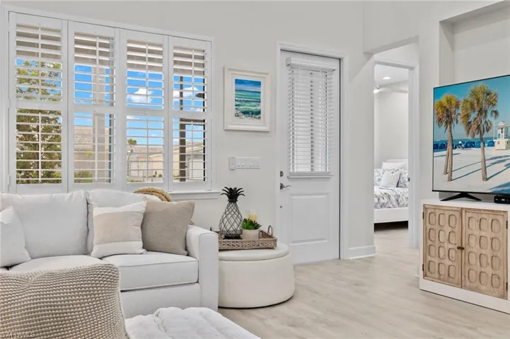 Living room with light hardwood / wood-style floors