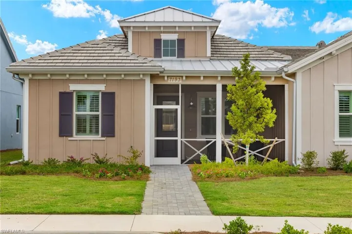View of front of property with a front yard