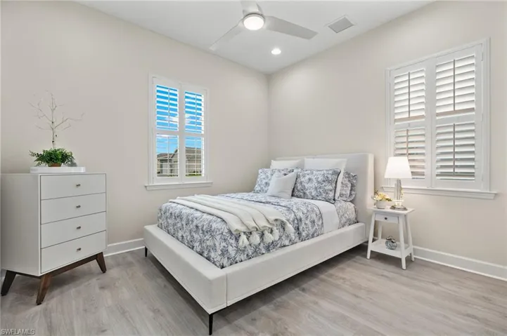 Bedroom with light wood-type flooring and ceiling fan
