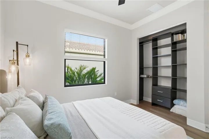 Bedroom featuring wood finished floors and ceiling fan