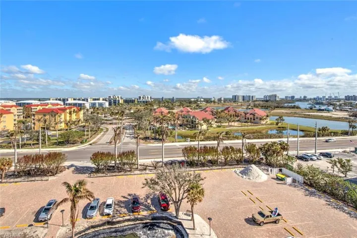 Birds eye view of property with a water view