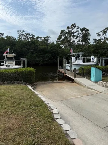 Dock with a boat ramp and a water view