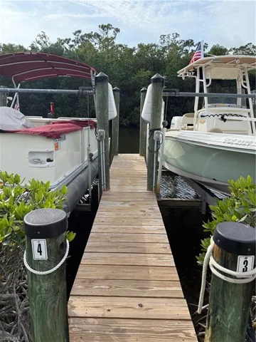 Dock featuring a water view and boat lift