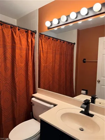Guest Bathroom featuring vanity and a shower with curtain