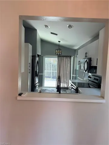 Breakfast bar looking into kitchen