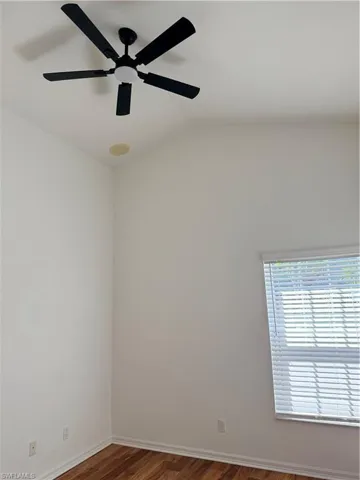 vaulted ceiling, and ceiling fan make room spacious