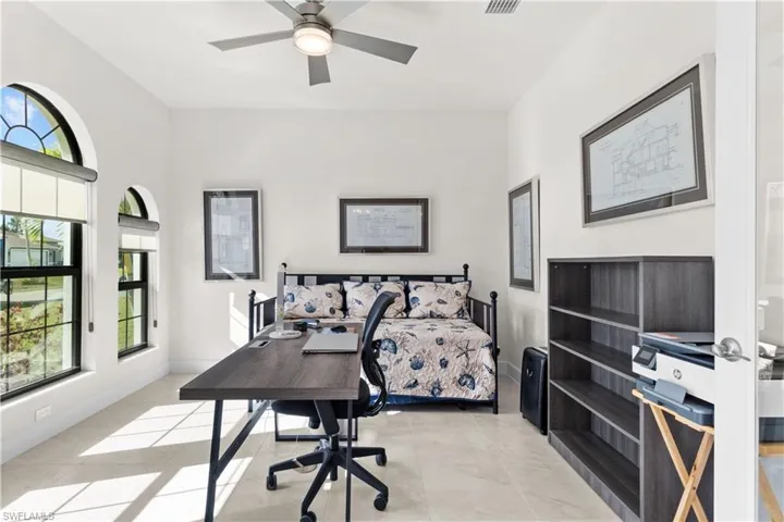 Tiled bedroom with ceiling fan