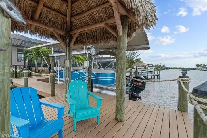 Dock area with a water view and a lanai