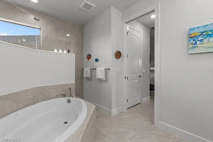 Bathroom with tiled tub