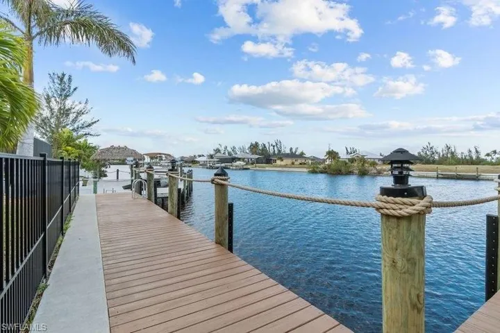 Dock area featuring a water view