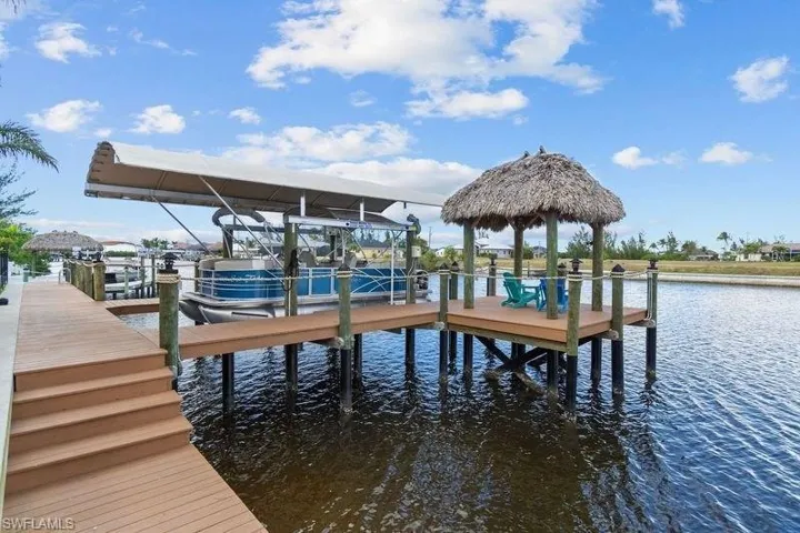 Dock area featuring a water view