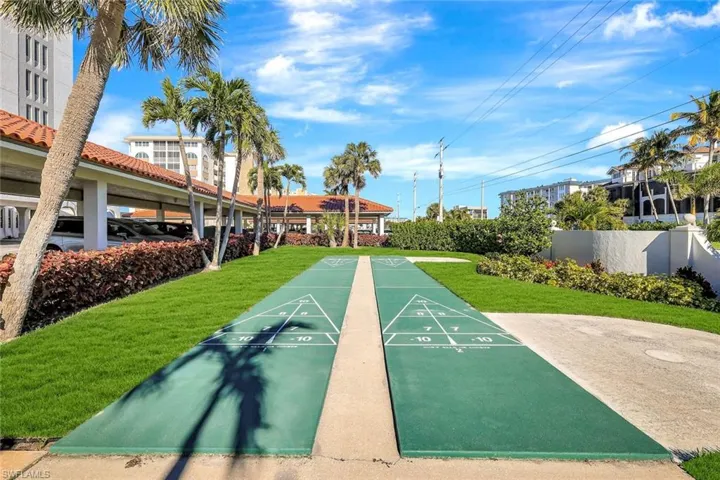 View of home's community with shuffleboard