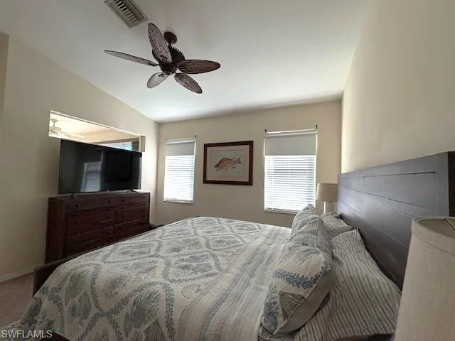 Bedroom with ceiling fan and carpet floors
