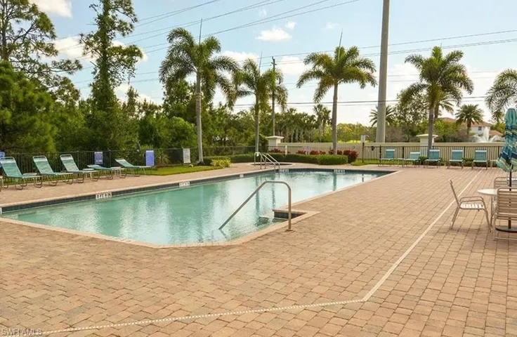 Community pool with a patio area