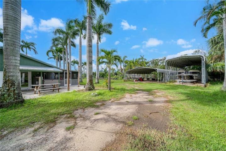 Side yard entry to backyard and 2 large carports