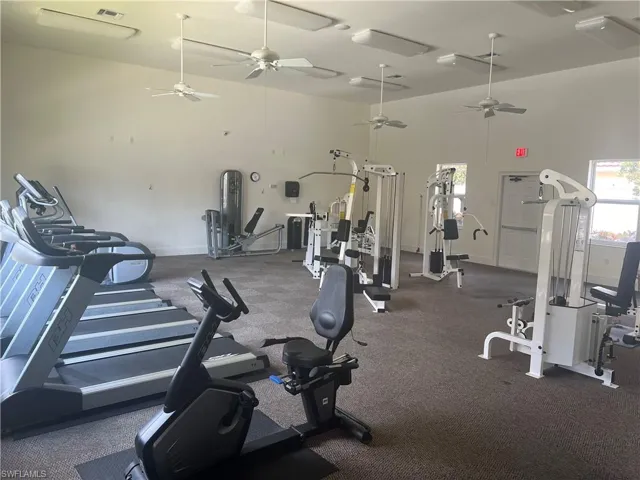 Workout area with a towering ceiling