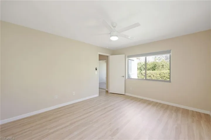 Spare room featuring light wood finished floors and ceiling fan