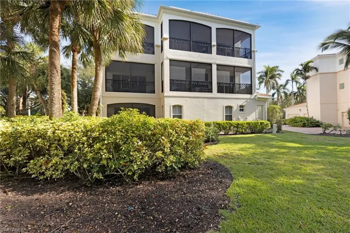 Rear view of property featuring a yard